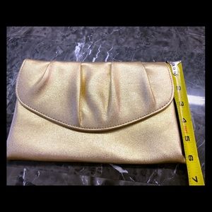 Beautiful vintage Gold clutch with snap closure